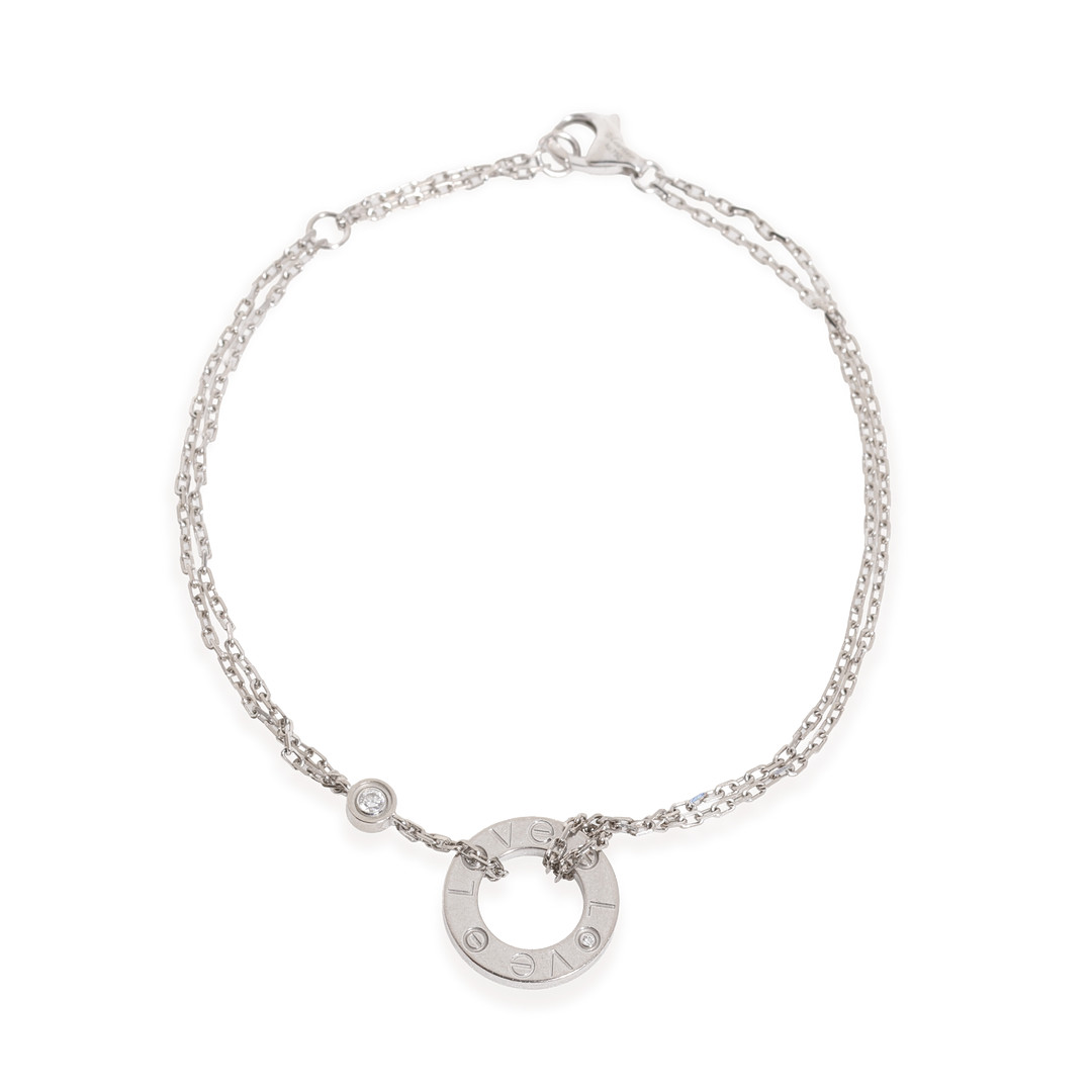 Cartier "Love"-armbånd på kæde af 18 kt hvidguld, prydet med to brillantslebne diamant på i alt 0,03 carat.