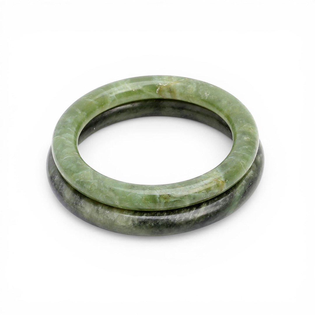 Two Chinese jade bangle bracelets.