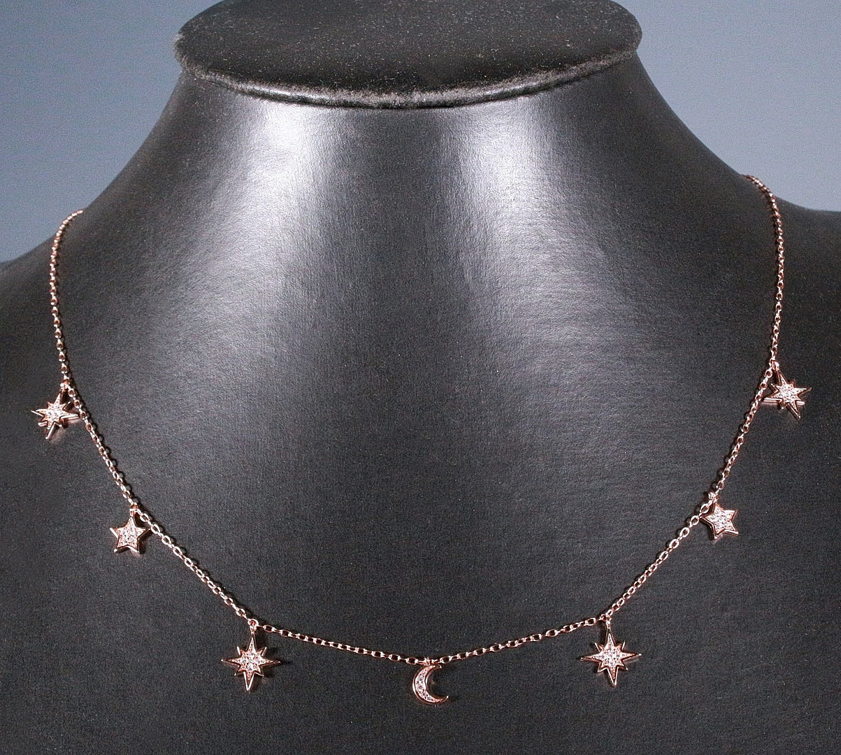 MERALIN JEWELRY. Halskette mit Mond- und Sternenanhängern, besetzt mit Zirkonia, 925er Sterlingsilber, rosévergoldet, Italien.
