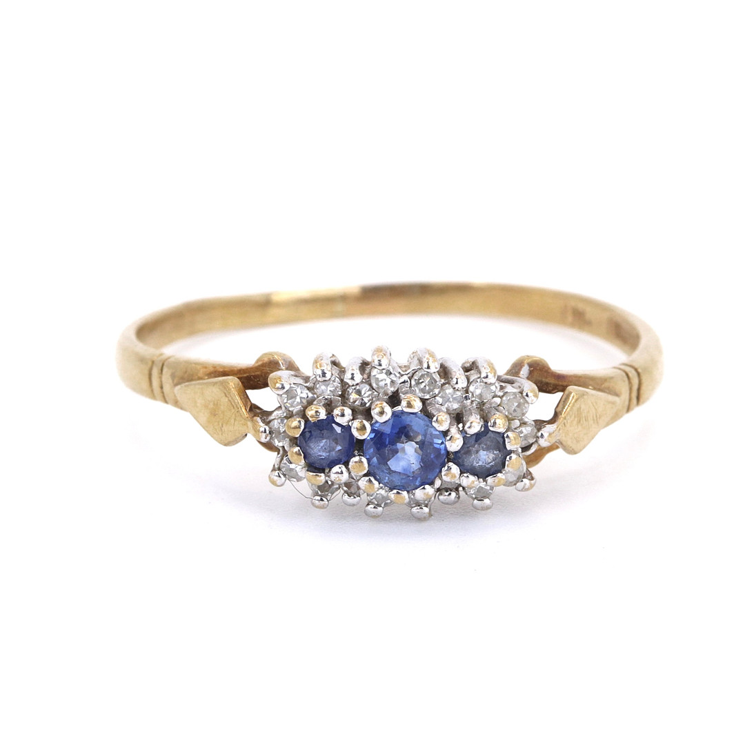 9CT SAPPHIRE AND DIAMOND RING.