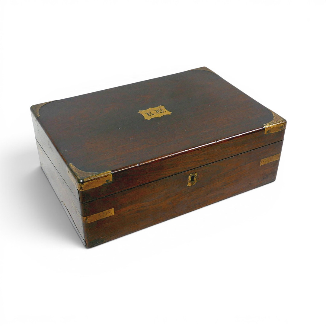 A 19TH CENTURY ROSEWOOD WRITING SLOPE WITH BRASS CORNERS.