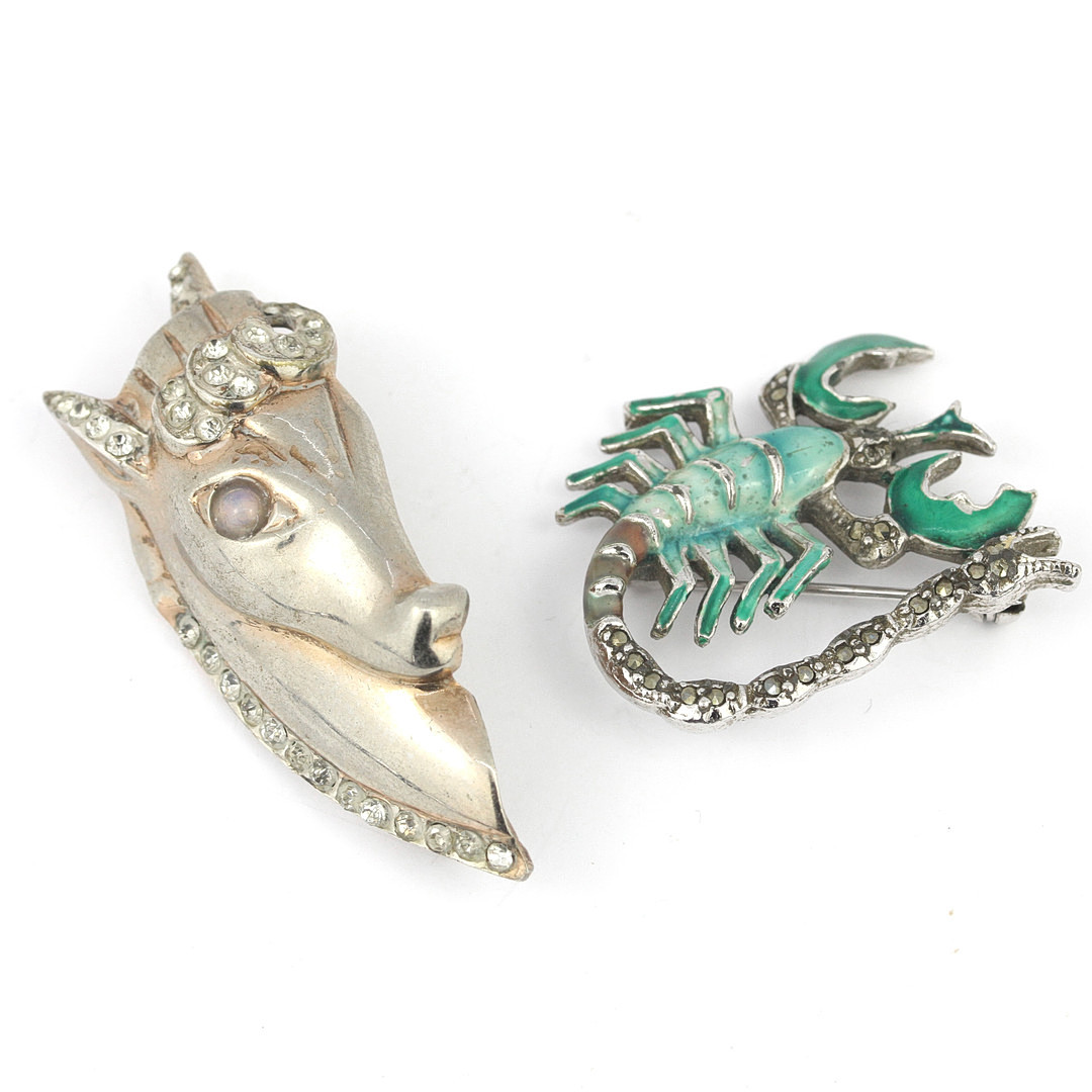 TWO SILVER ANIMAL BROOCHES.