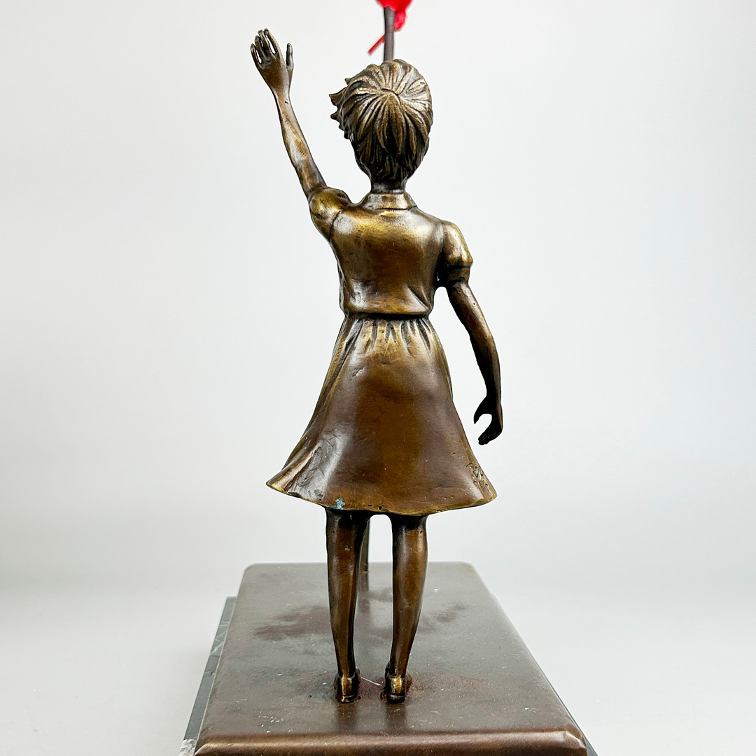 BRONZE BANKSY STYLE FIGURE.
