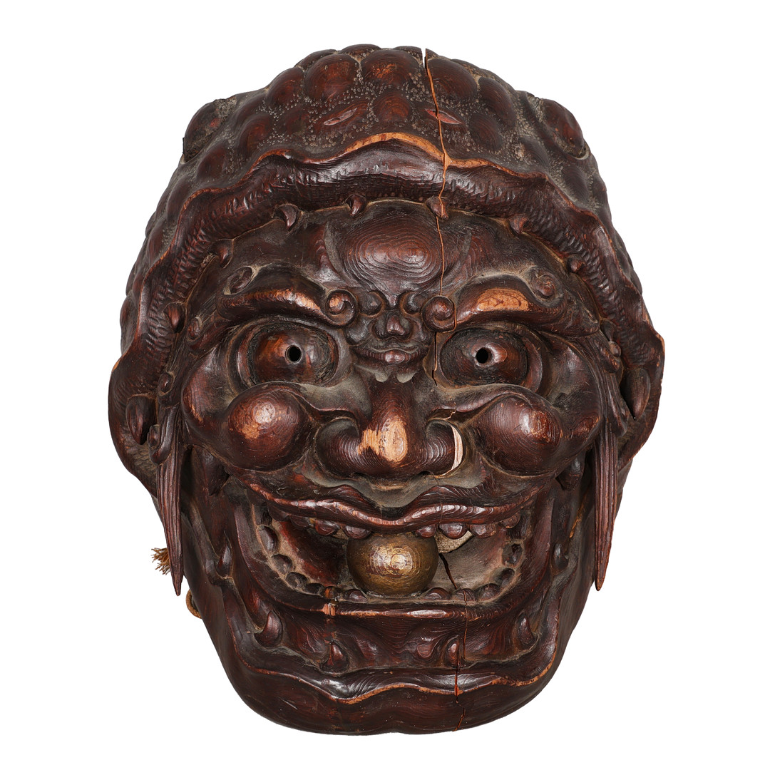 A NEPALESE OR TIBETAN CARVED MASK, POSSIBLY DEPICTING BHAIRAVA.
