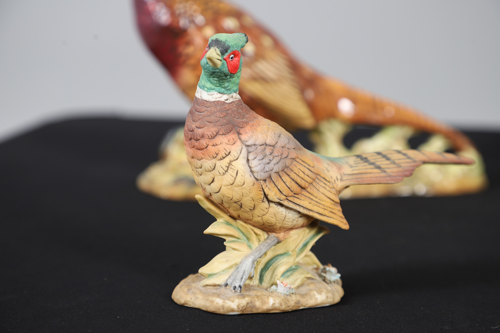 A BESWICK POTTERY MODEL OF A COCK PHEASANT.