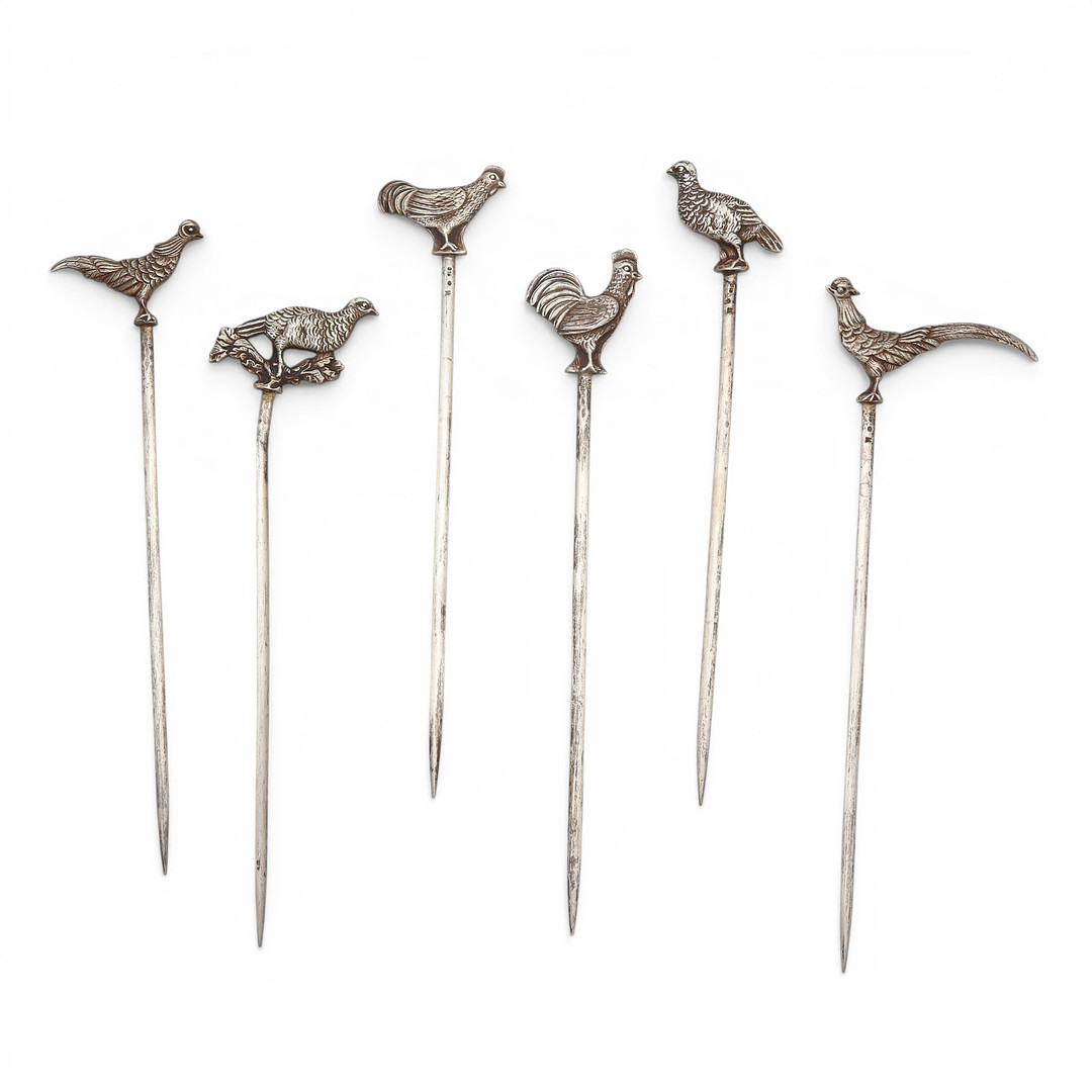 Set of six silver skewers topped with birds, 20th Century.