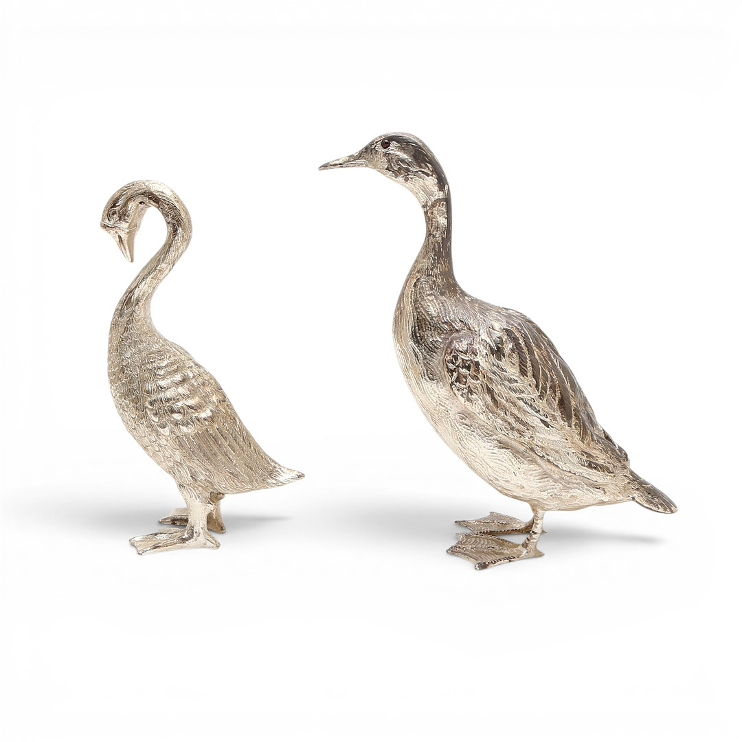 Pair of silvery metal ducks, circa 1970.