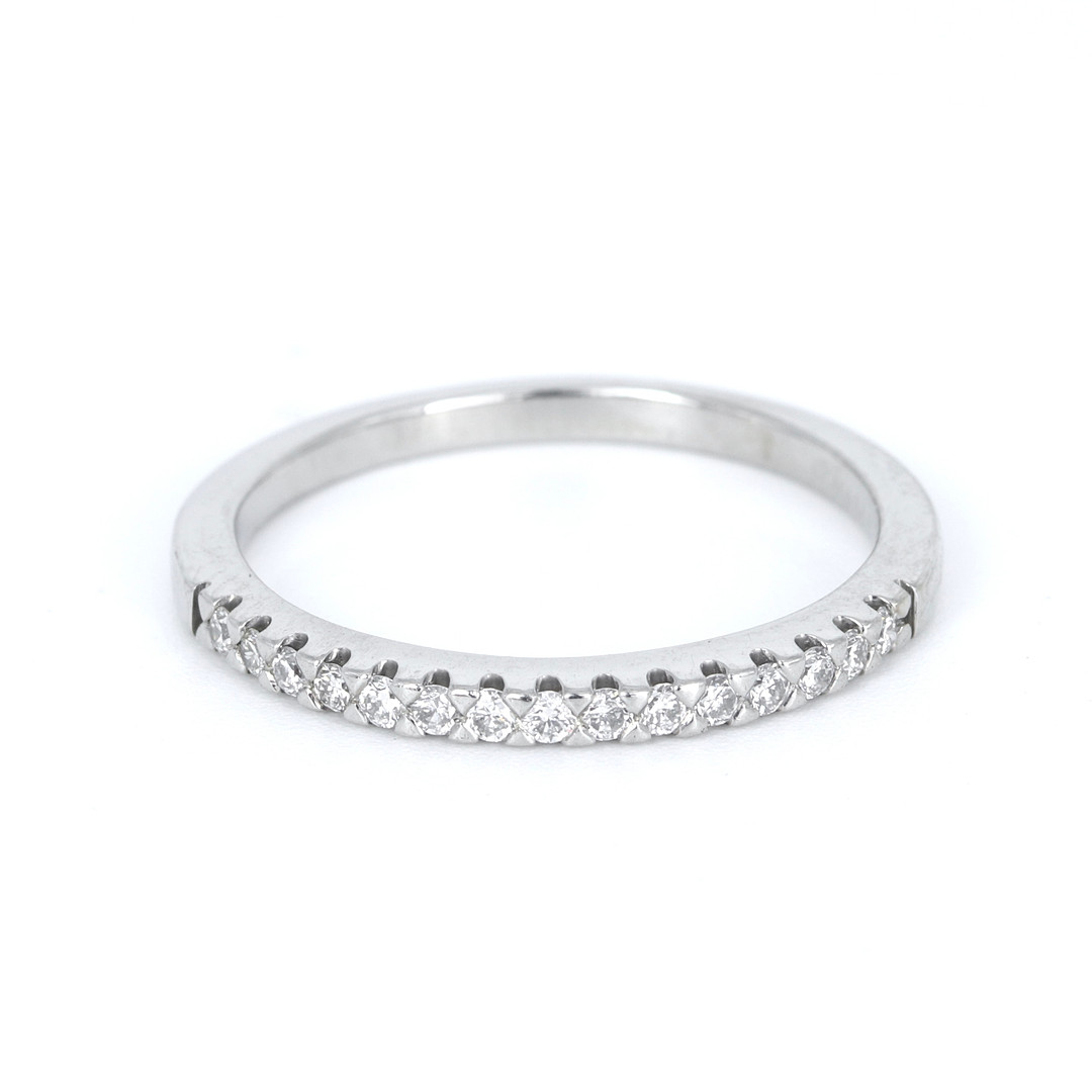 PLATINUM DIAMOND HALF ETERNITY RING.