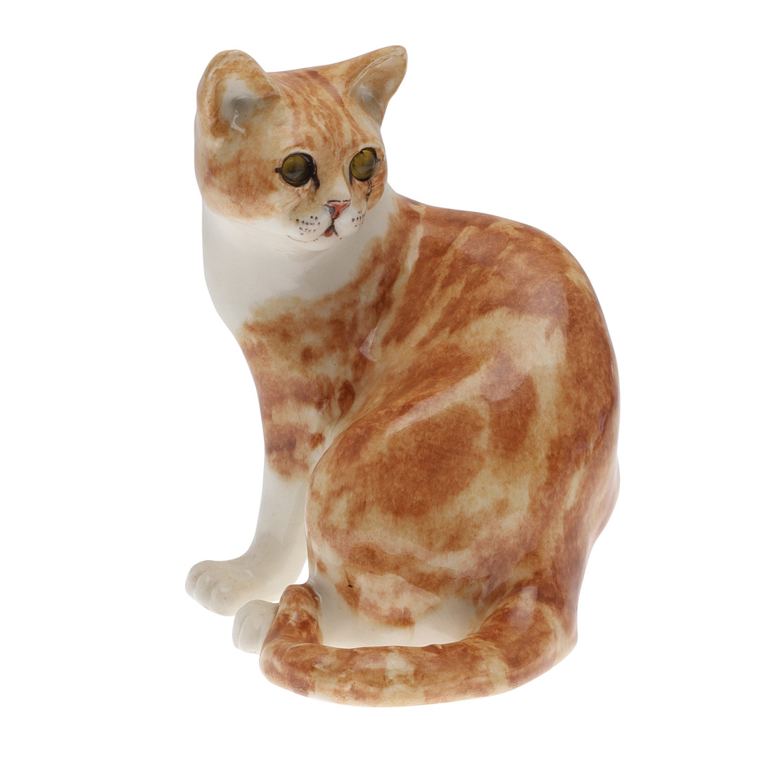 A WINSTANLEY POTTERY SEATED GINGER CAT.