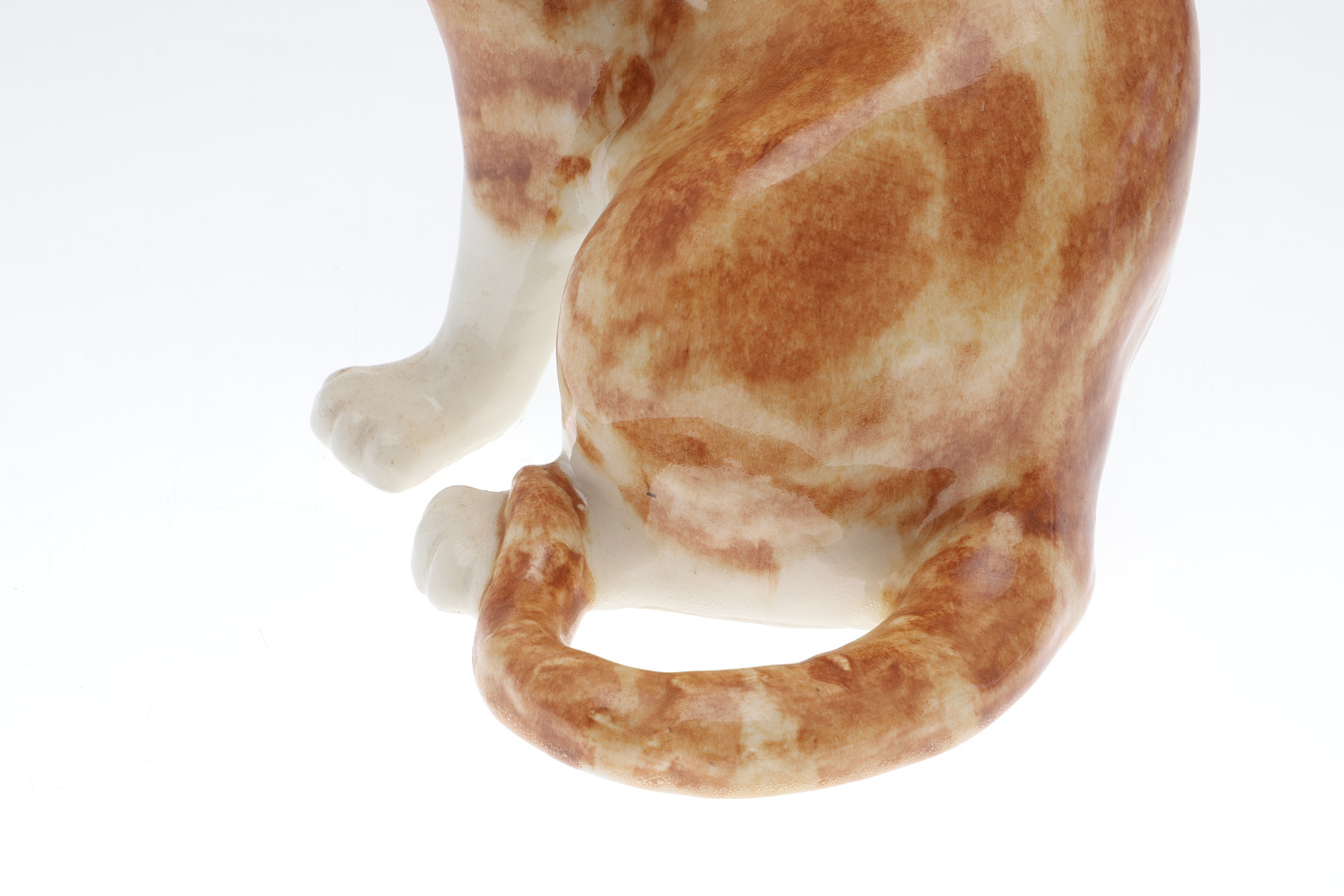 A WINSTANLEY POTTERY SEATED GINGER CAT.