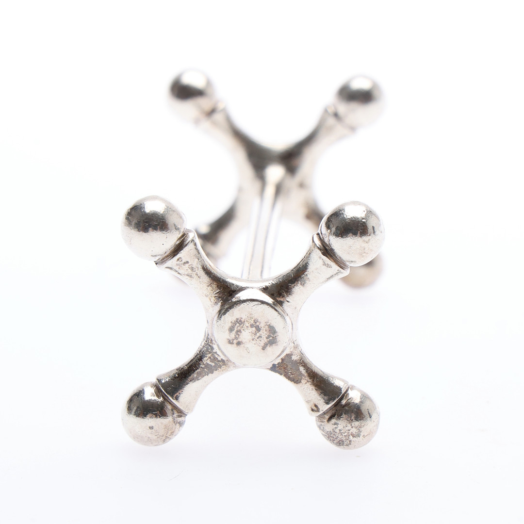 PAIR OF GEORGE V SILVER KNIFE RESTS.