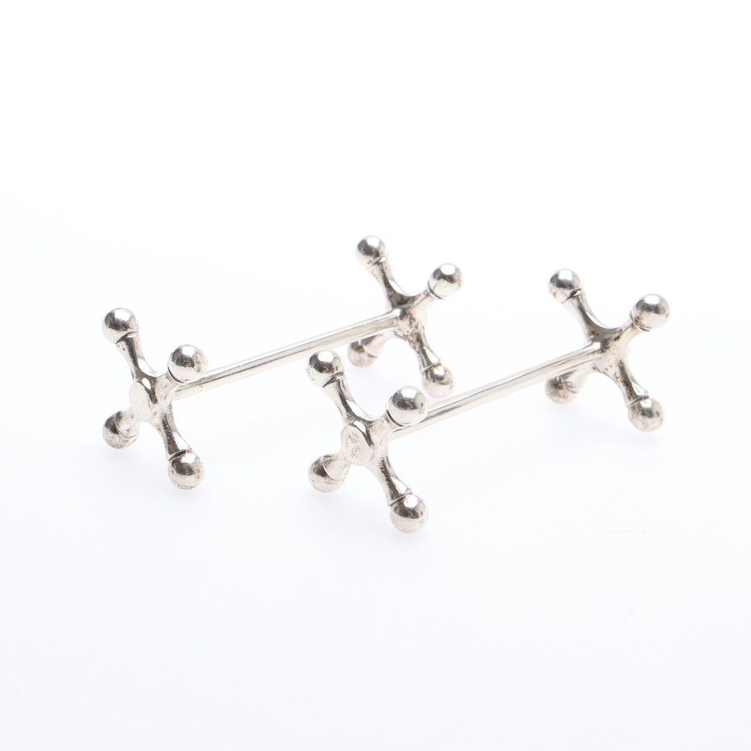 PAIR OF GEORGE V SILVER KNIFE RESTS.