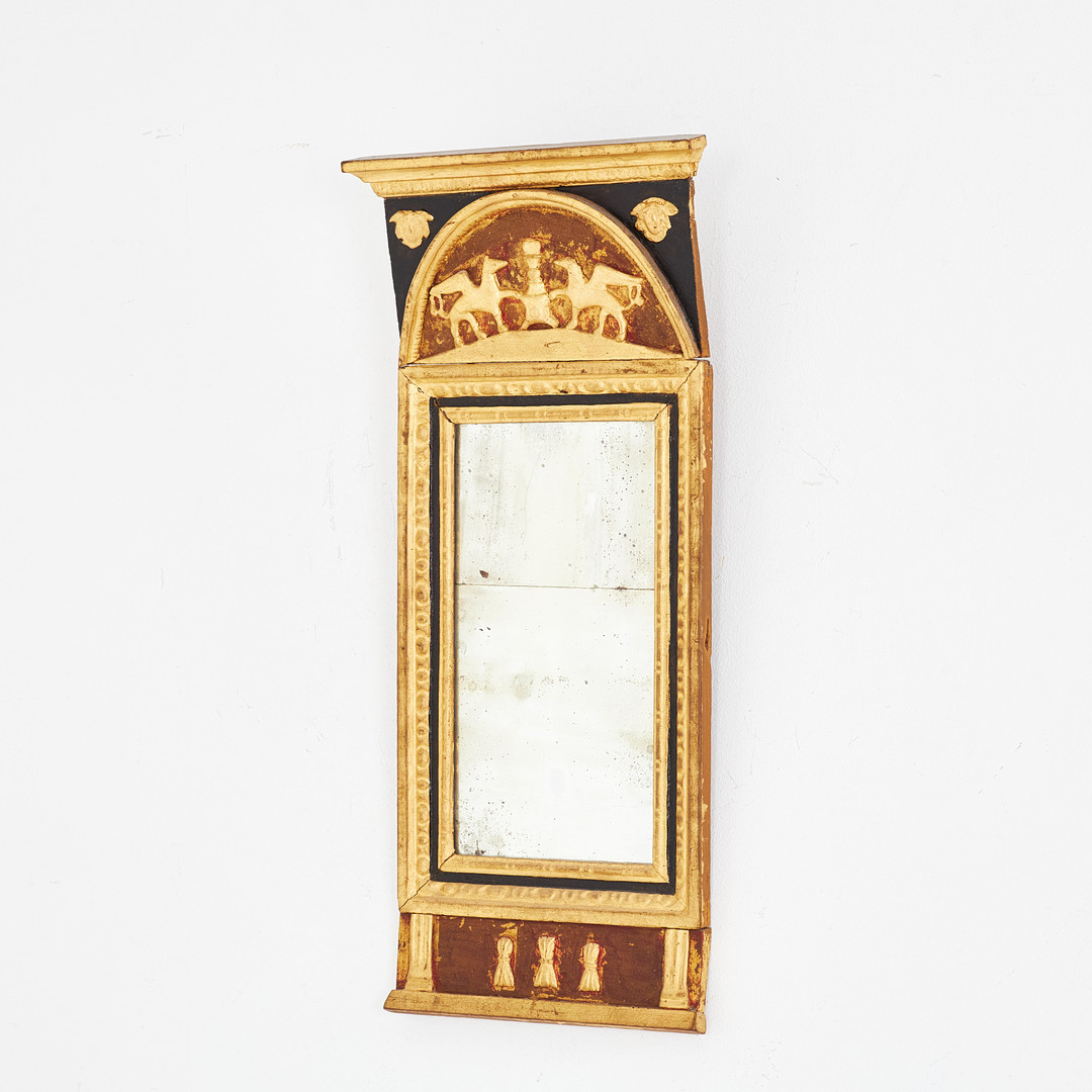 SPEGEL. Empire, 1800-talets första delar, tvådelat folierat spegelglas, pastellage, bronserad, antikiserande dekor.