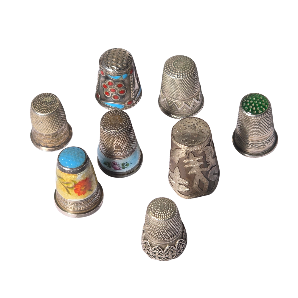 Colección de ocho dedales en plata y esmalte. Principios siglo XX.
