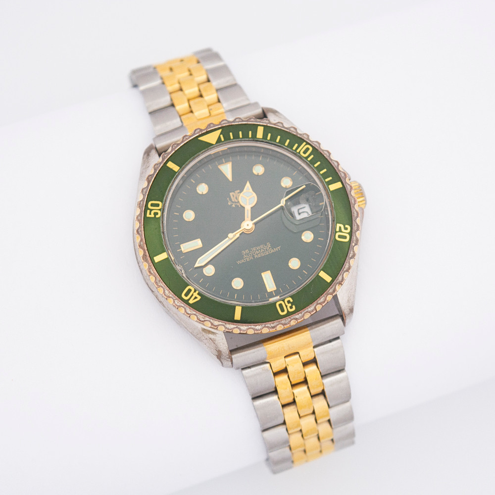 RE WATCH ARMBANDUHR. TAUCHERUHR, 35 STEINE, AUTOMATIK, UHRWERK DURCH DEN GEHÄUSEBODEN ZU SEHEN, METALL, WASSERDICHT, DATUMSANZEIGE.