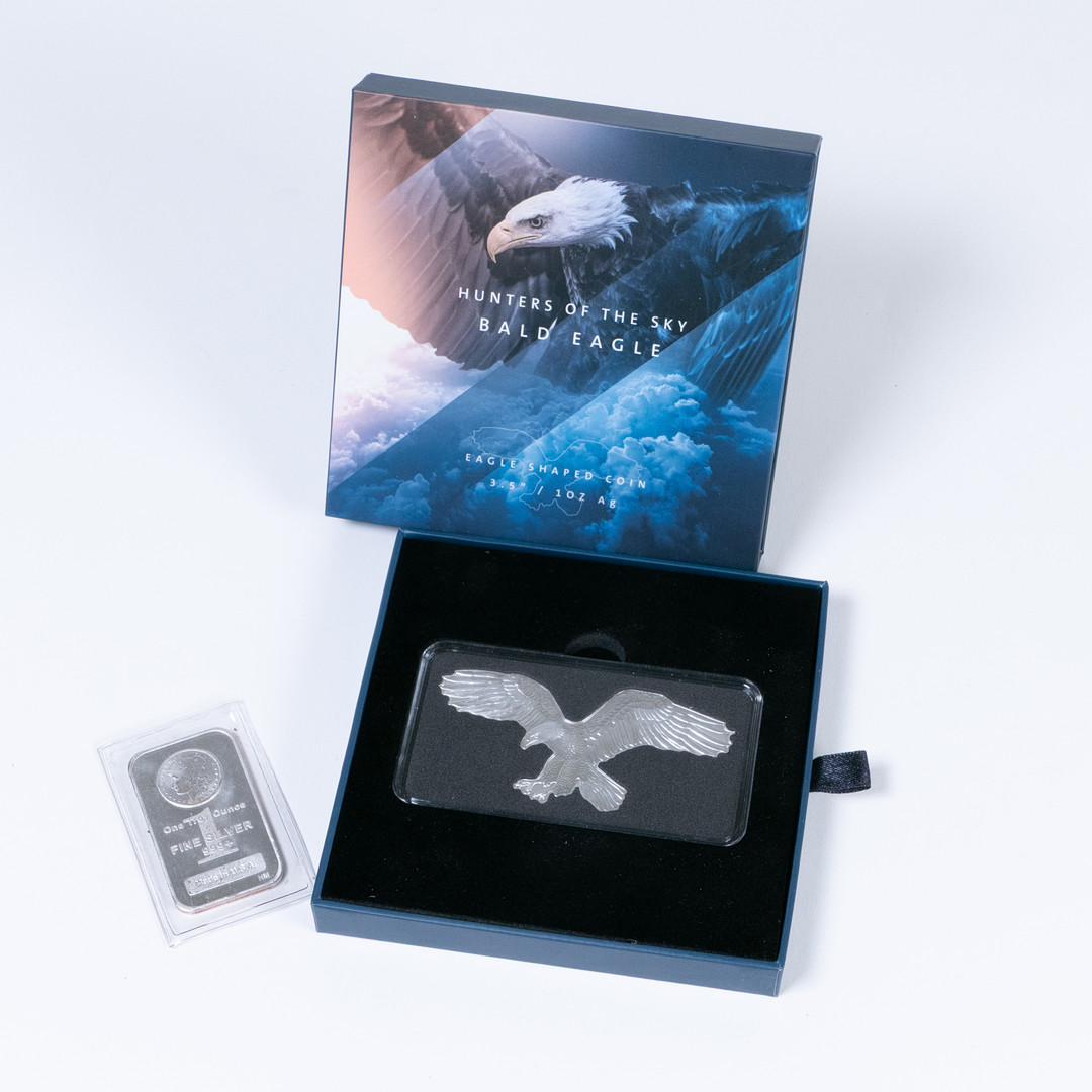 Mynt 2 st, finsilver 999, 1 oz, Salomonöarna resp. USA.