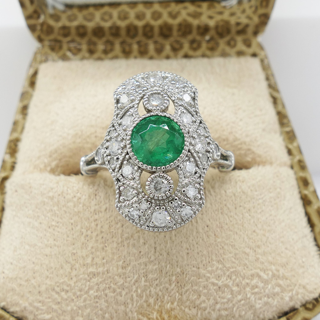 PLATINUM, EMERALD & DIAMOND ring.