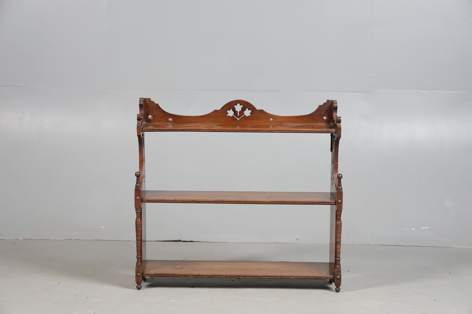 A 19TH CENTURY MAHOAGNY SET OF HANGING SHELVES.