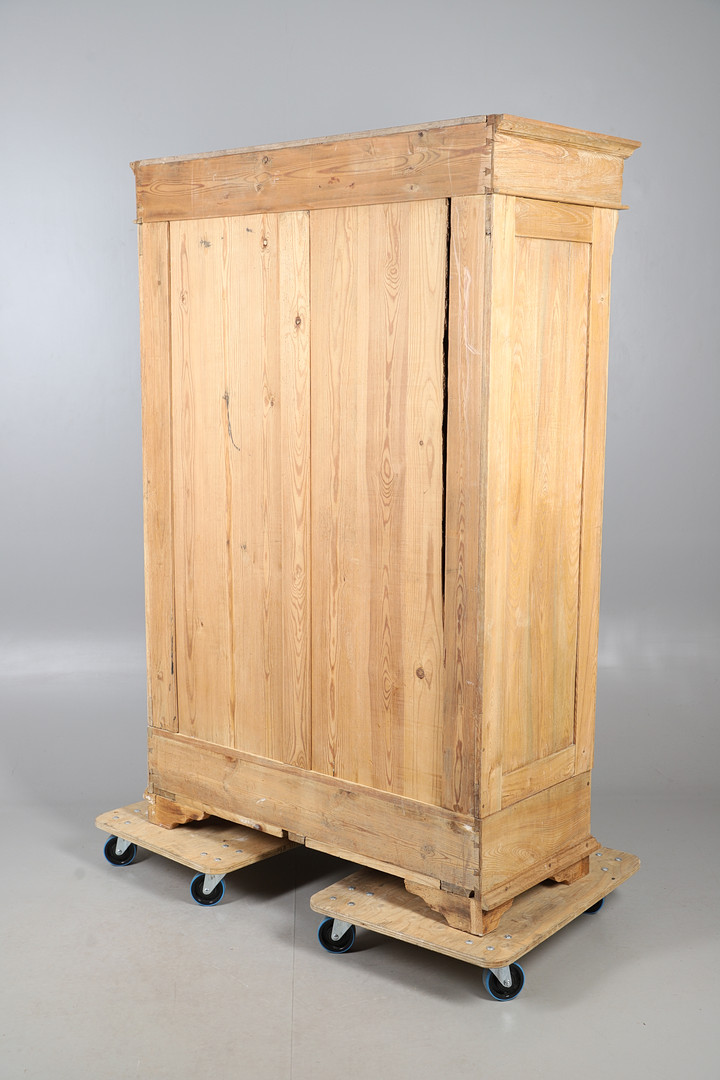 A VICTORIAN STRIPPED PINE WARDROBE.