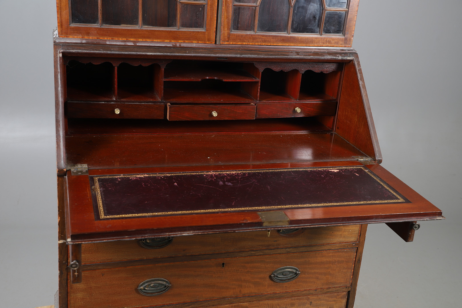 A MAHOGANY INLAID BUREAU BOOKCASE.