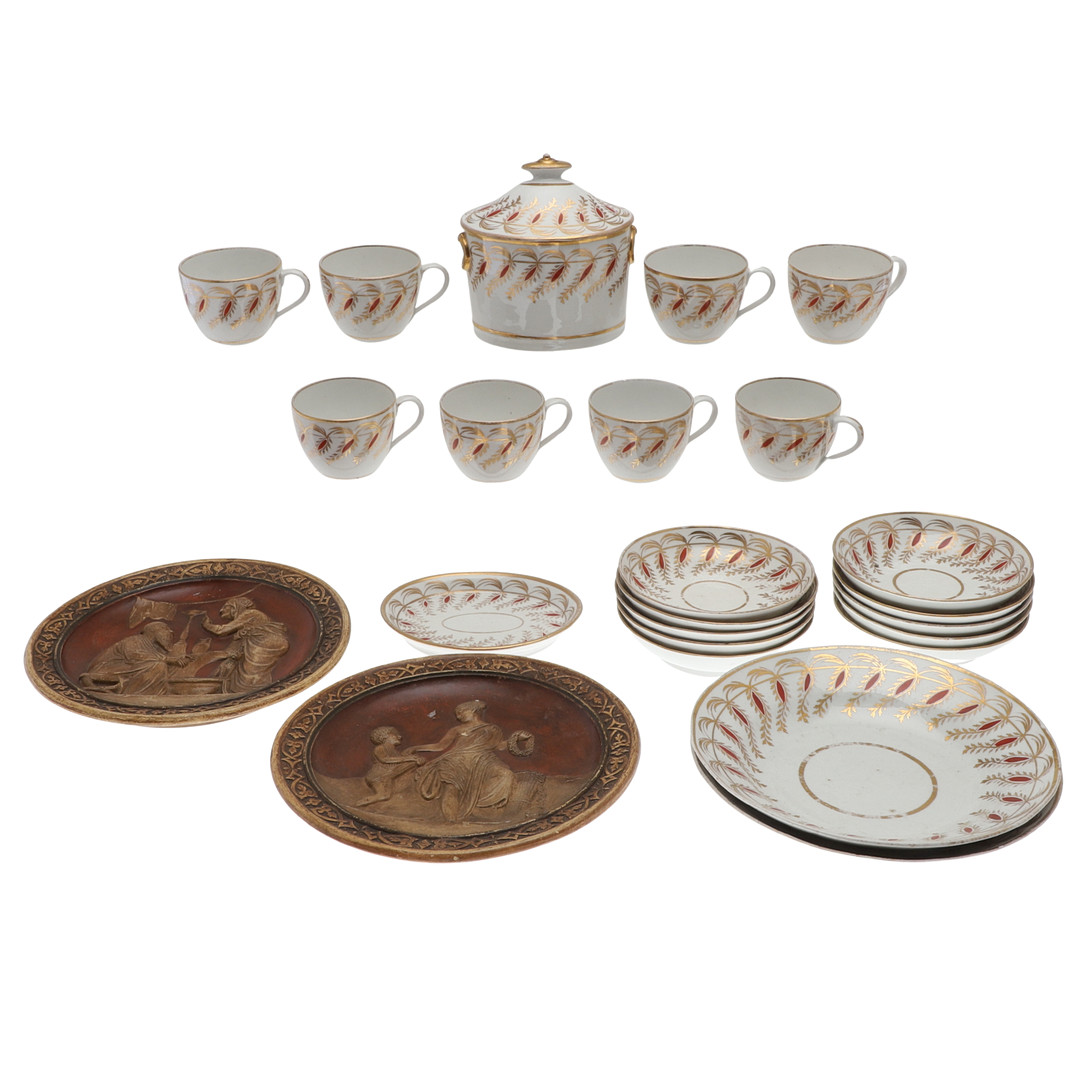 A 19TH CENTURY PART TEA SERVICE AND TWO DECORATIVE WALL PLAQUES.