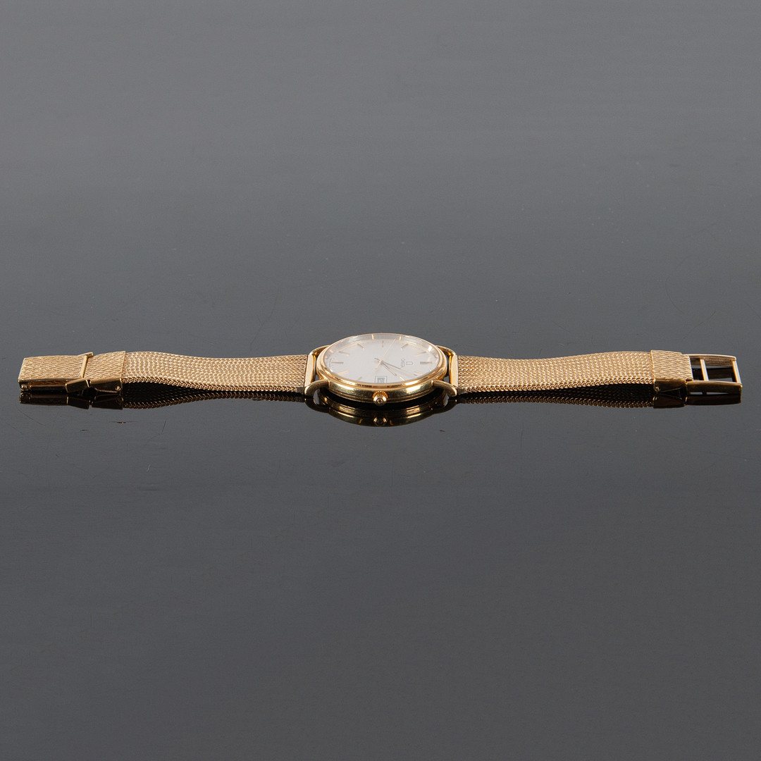 Omega 18 k guld.