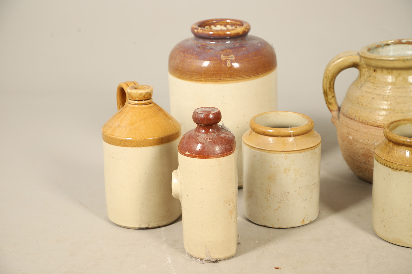 A QUANTITY OF 19TH CENTURY LARGE STONEWARE JARS AND CONTAINERS.