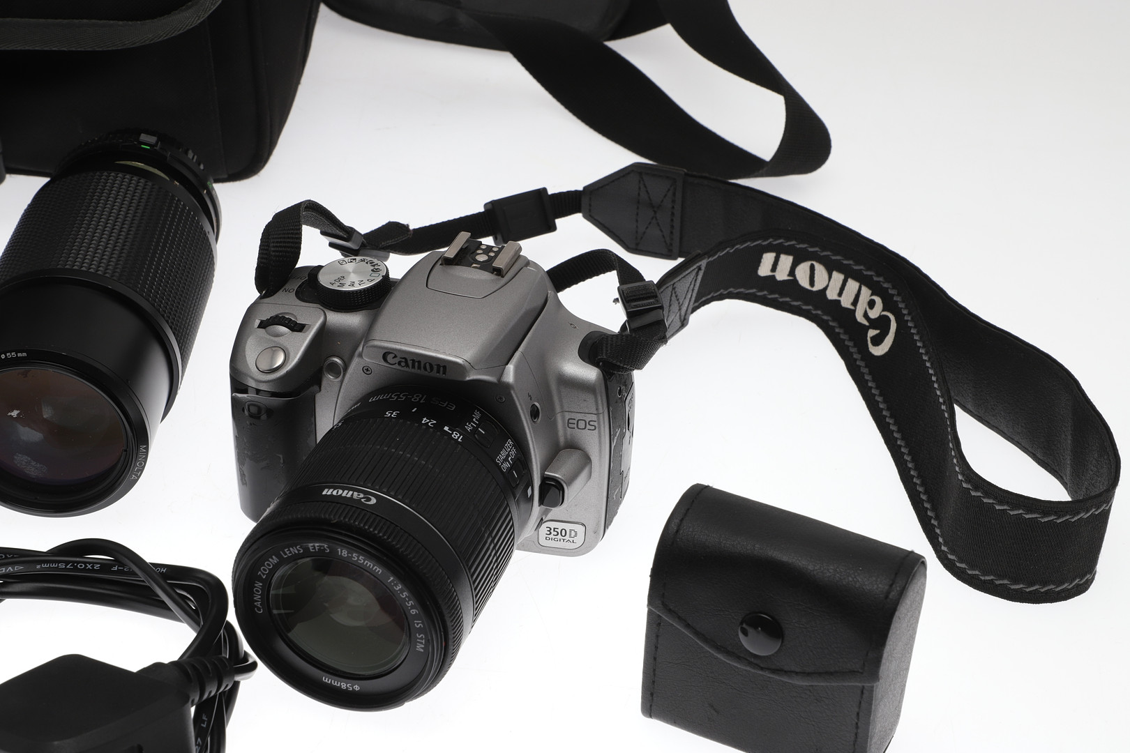 A CANON E0S 350D DIGITAL CAMERA AND VARIOUS ACCESSORIES.