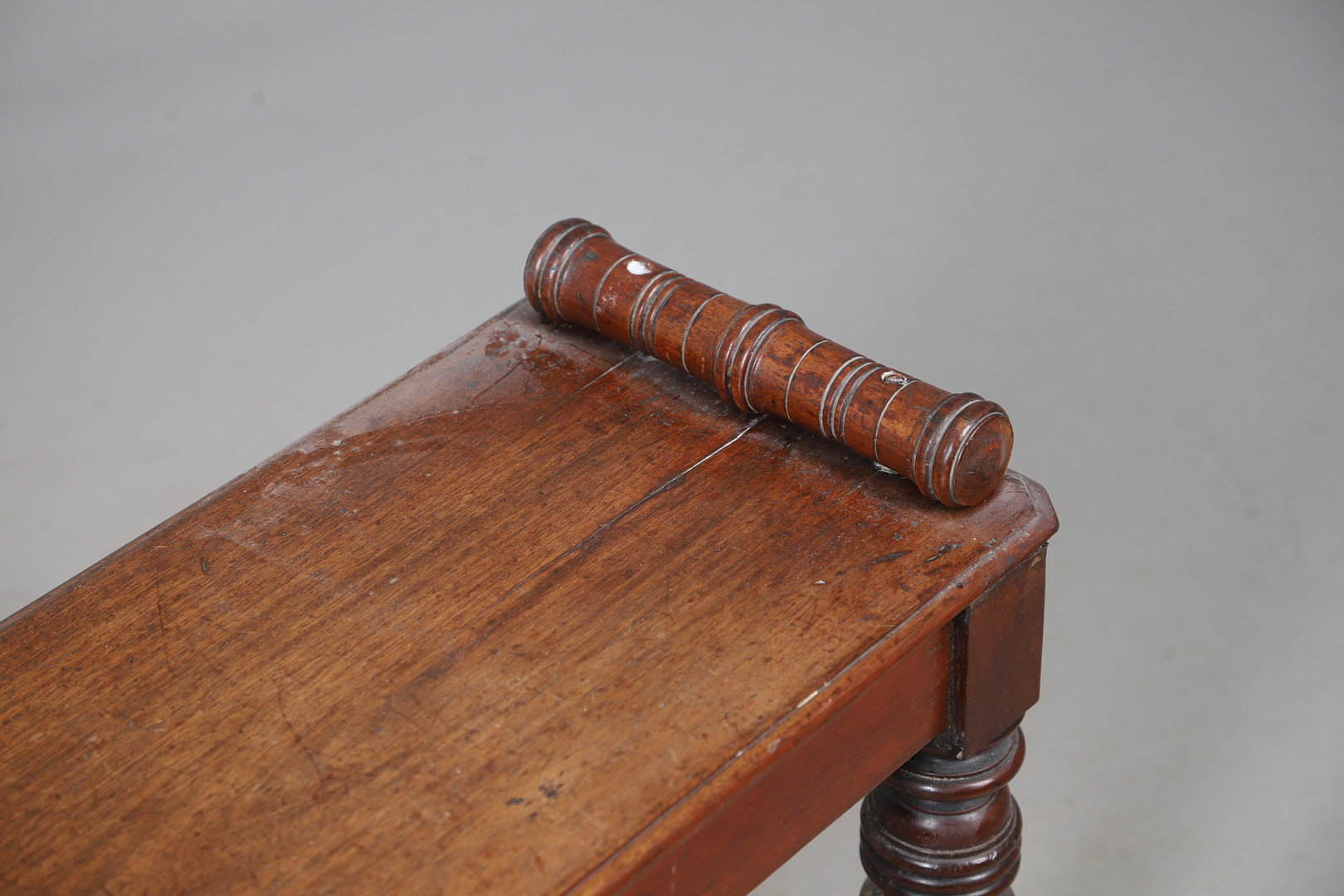 A VICTORIAN MAHOGANY WINDOW SEAT.