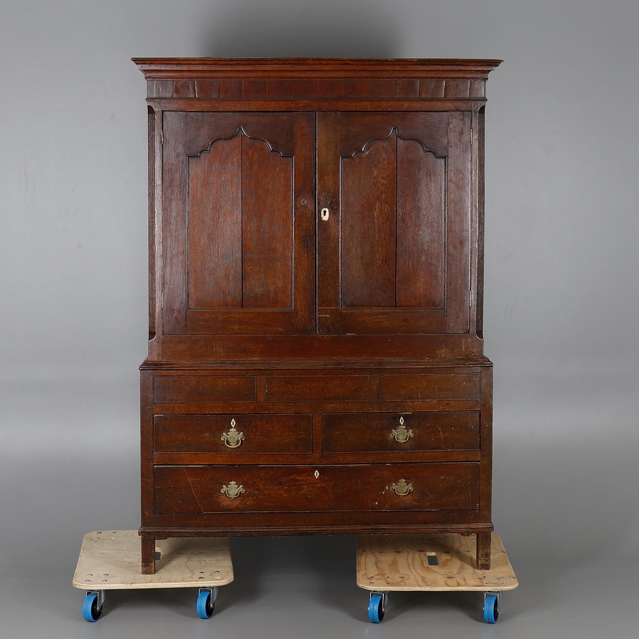 AN OAK PRESS CUPBOARD.