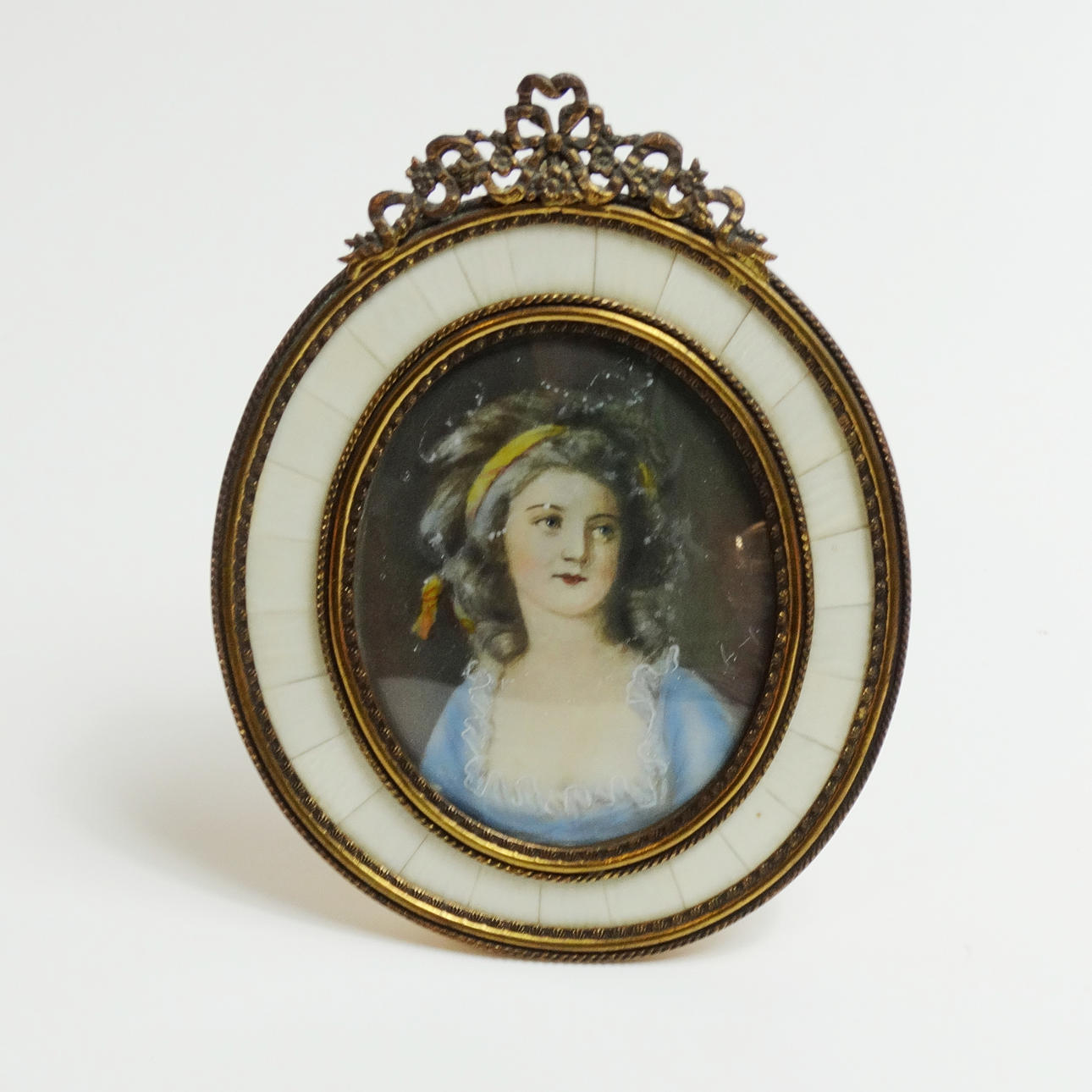 MINIATURE PORTRAIT, with brass frame, around 1950.