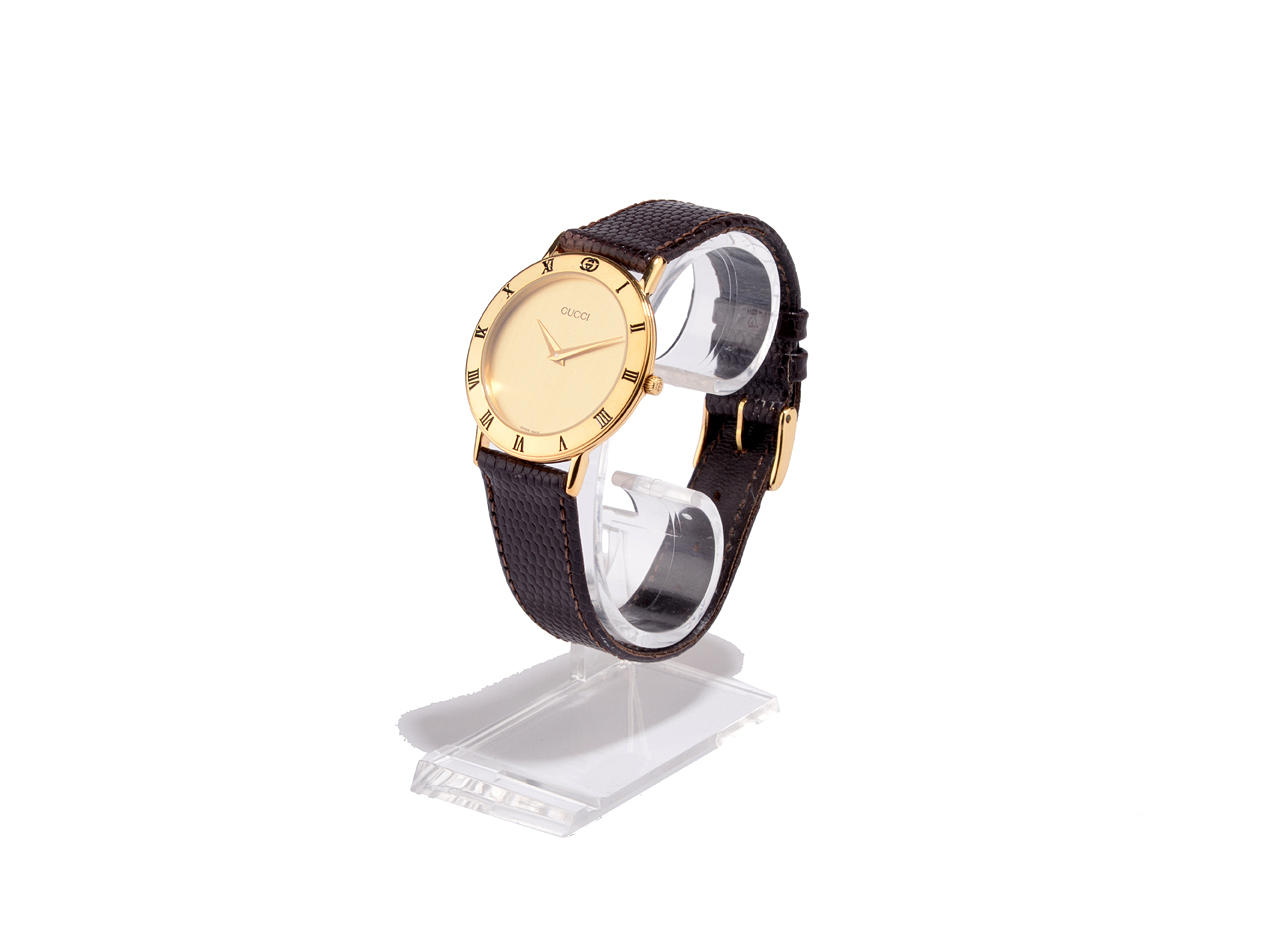 GUCCI. Unisex WRISTWATCH with leather strap.
