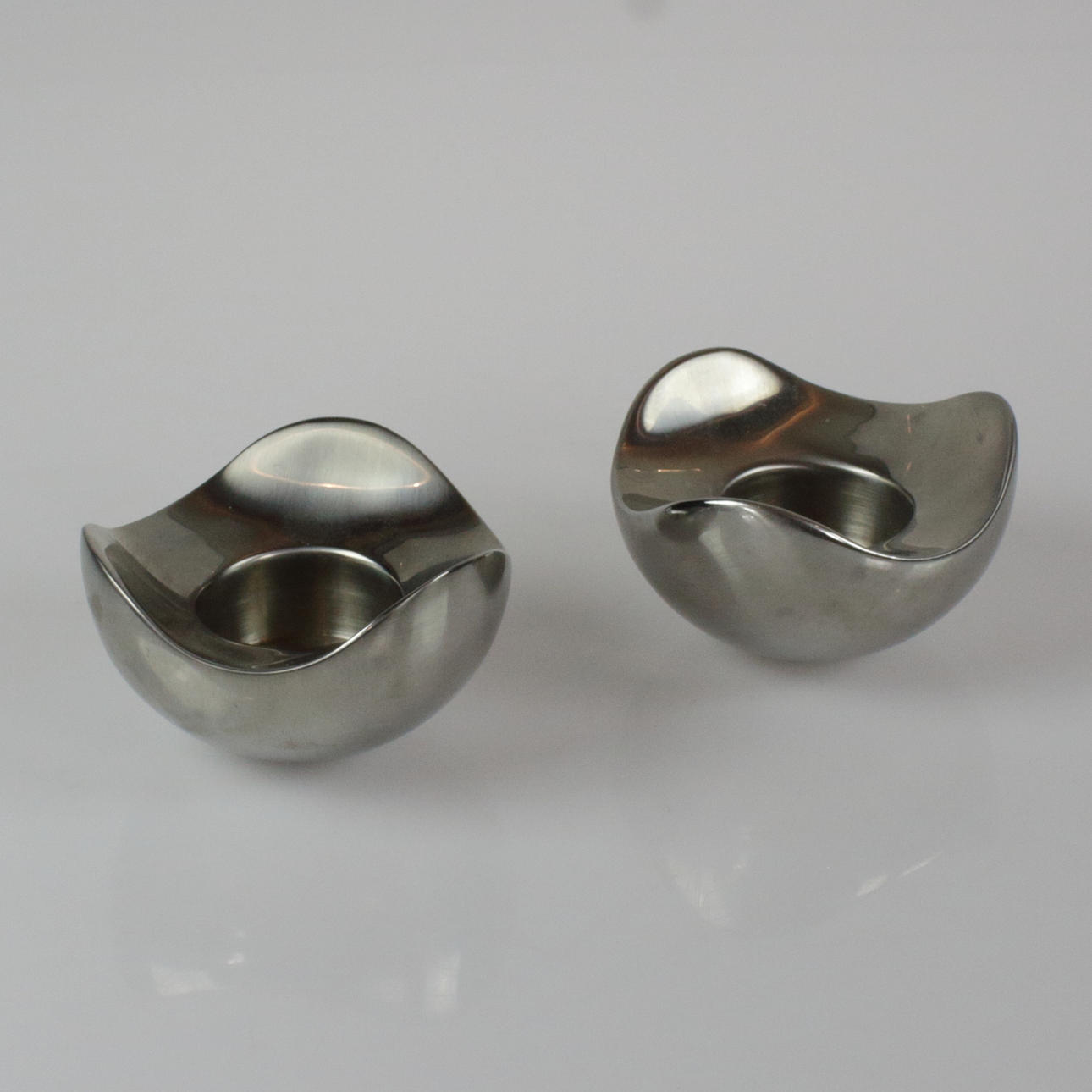 GEORG JENSEN. candlesticks, 2 pcs., "Bloom", stainless steel, Denmark.