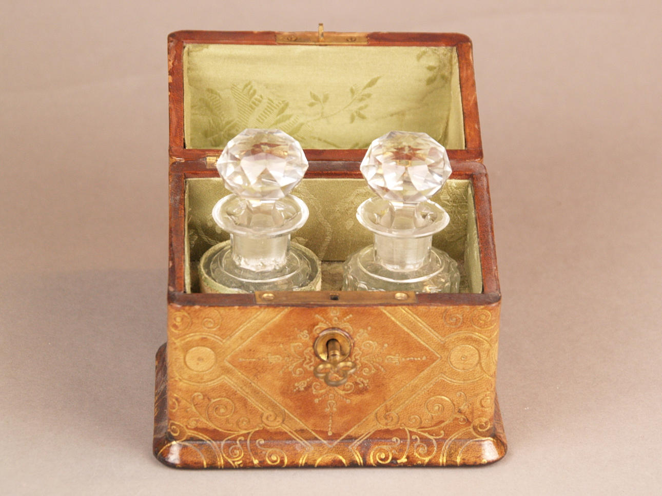 Old leather box with two PERFUME BOTTLES.