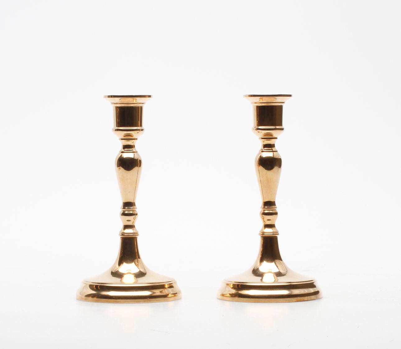 LJUSSTAKAR, ett par, malm, Bersbo 1981.