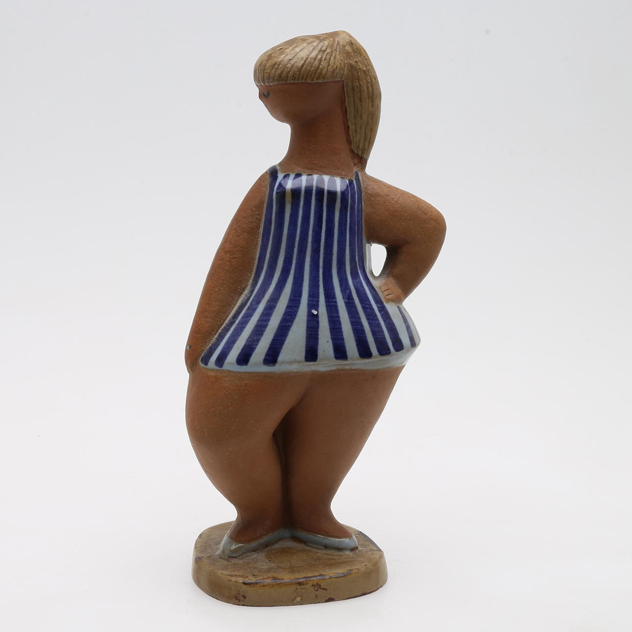 LISA LARSON. FIGURE "DORA, PARTIALLY GLAZED EARTHWARE.