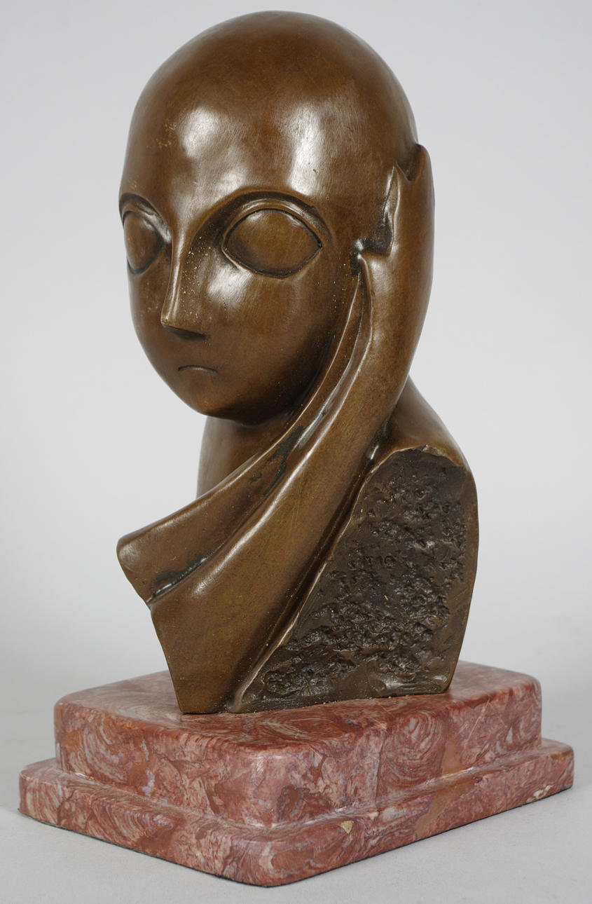 MAX MILO. Bronsskulptur på marmorsockel, ansiktskomposition.