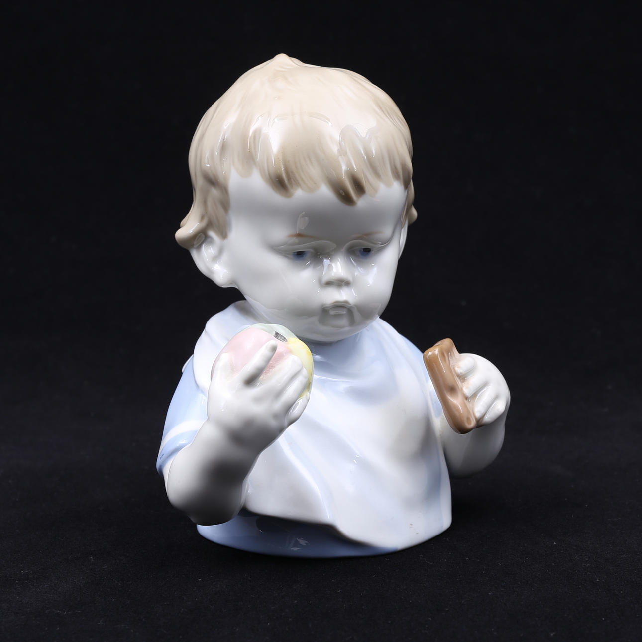 FIGURINE, boy with snack, porcelain, GDR.
