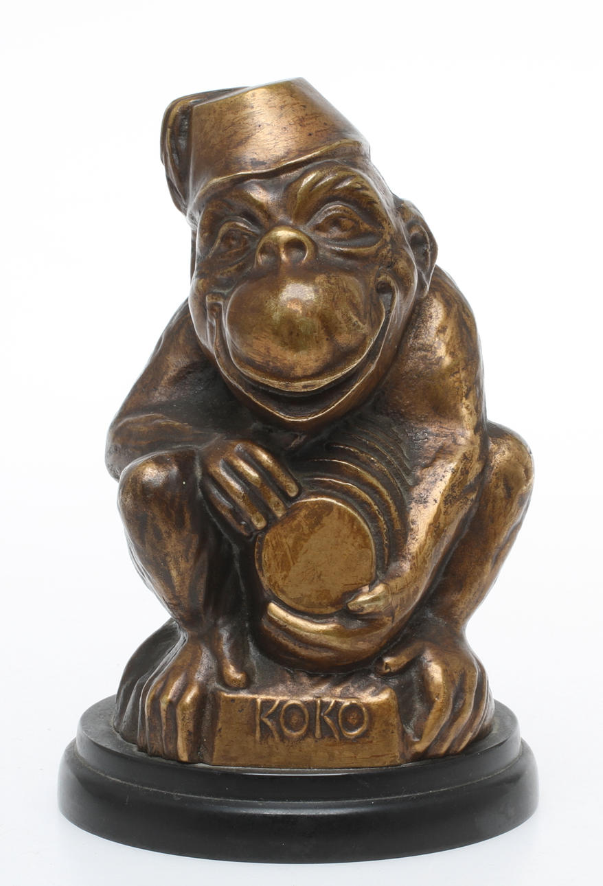 SPARBÖSSA, brons, i form av en apa.