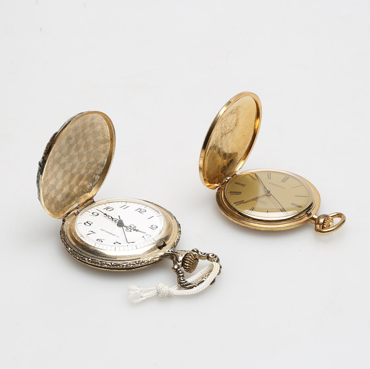 TASCHENUHR, 2 Stück, Metall, einschließlich Prätina.