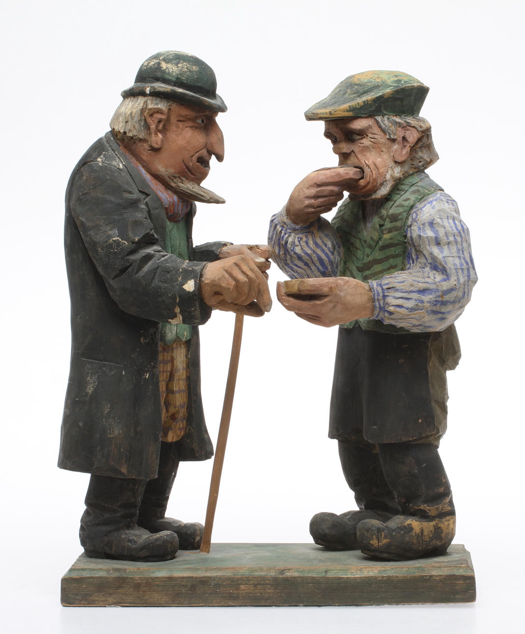 FIGURIN, Snusande gubbar, skuret och bemålat trä, 1900-tal.