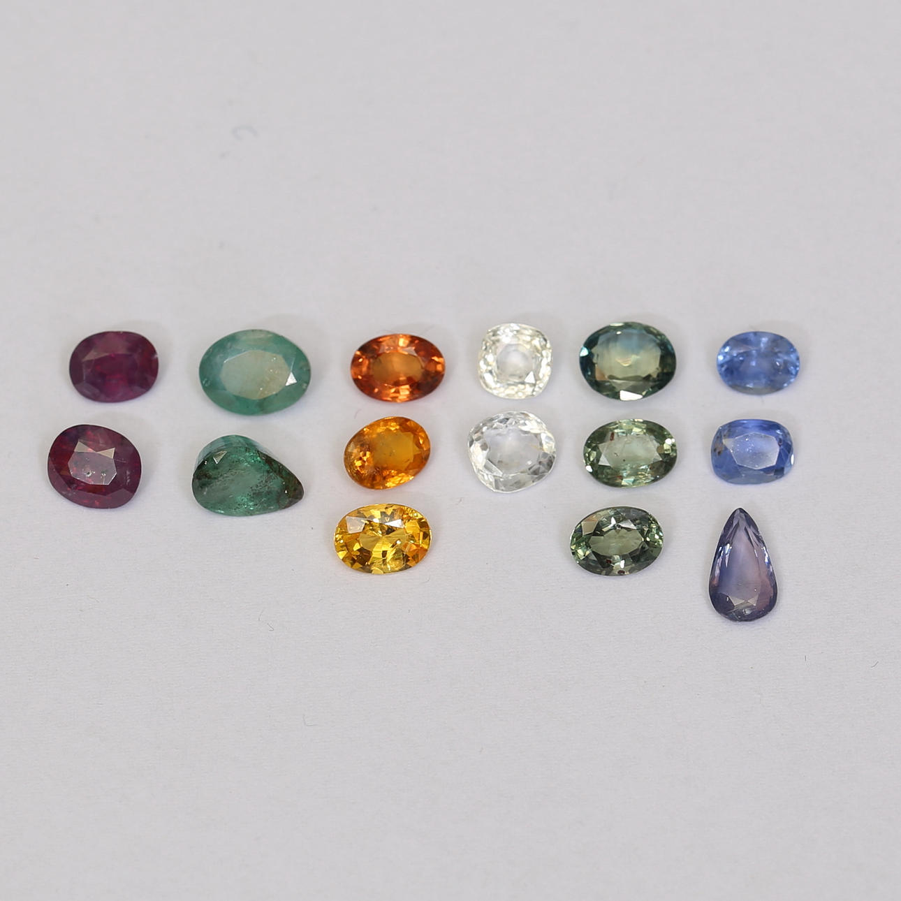 RUBIES, SAPPHIRES, EMERALDS, about 18.7ct.