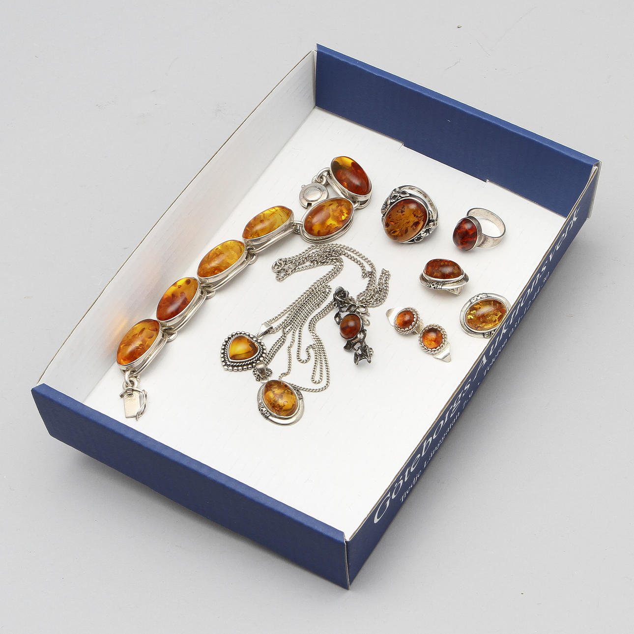 SMYCKEN, 10 delar, silver och bärnsten.