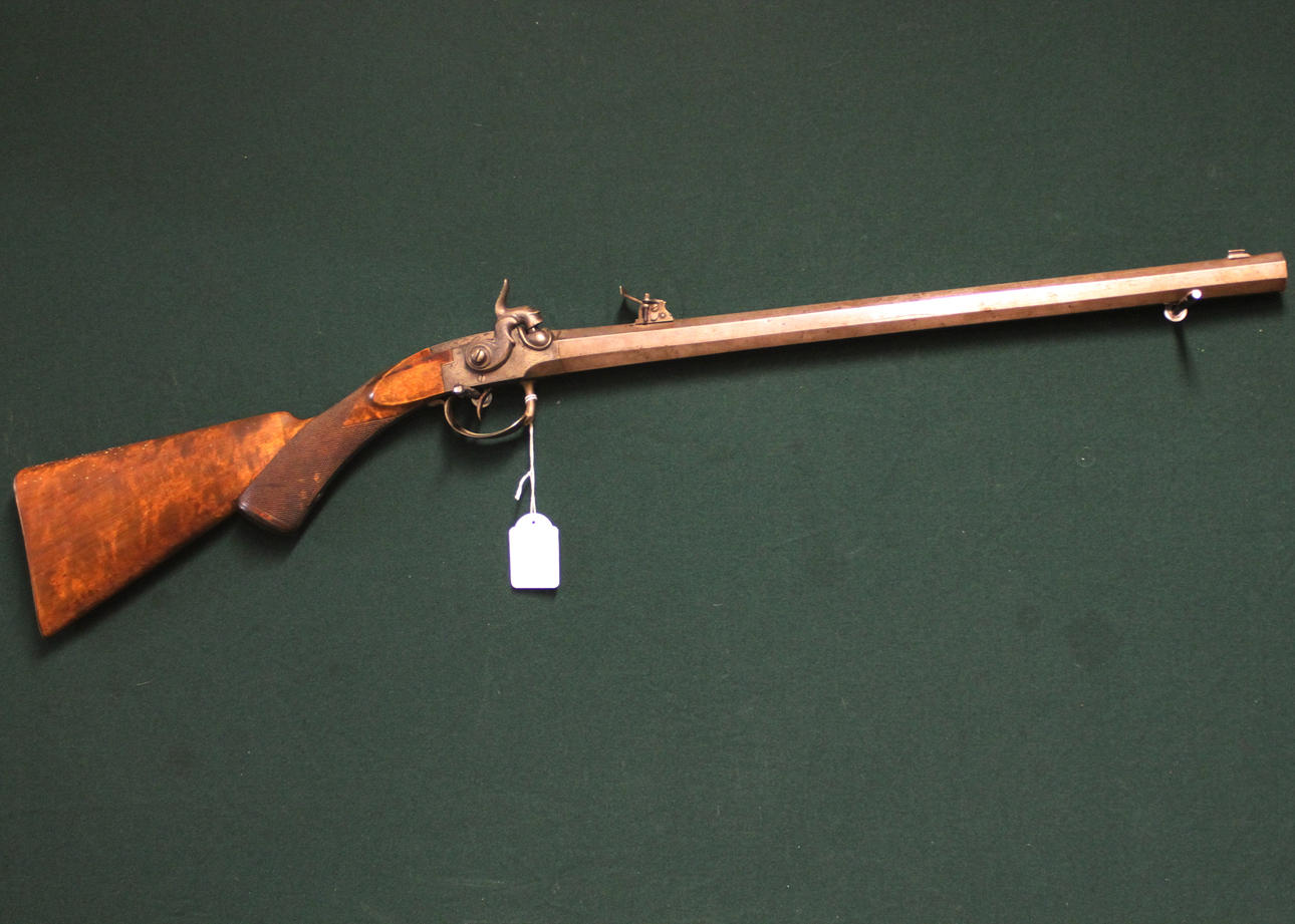 Small bolt-action rifle marked CJ Lindberg 1864.