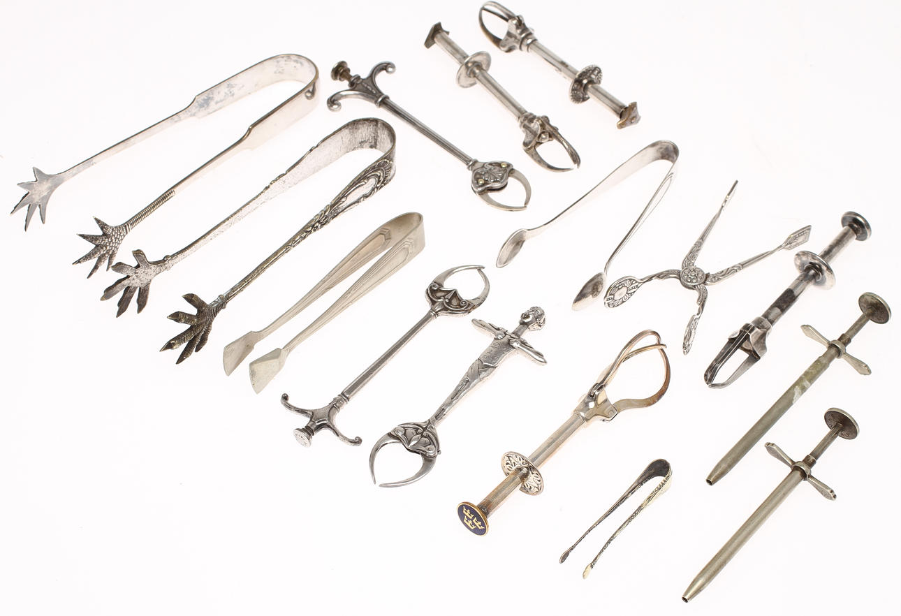 SOCKERTÄNGER, 15 st, mestadels nysilver, 1900-tal.