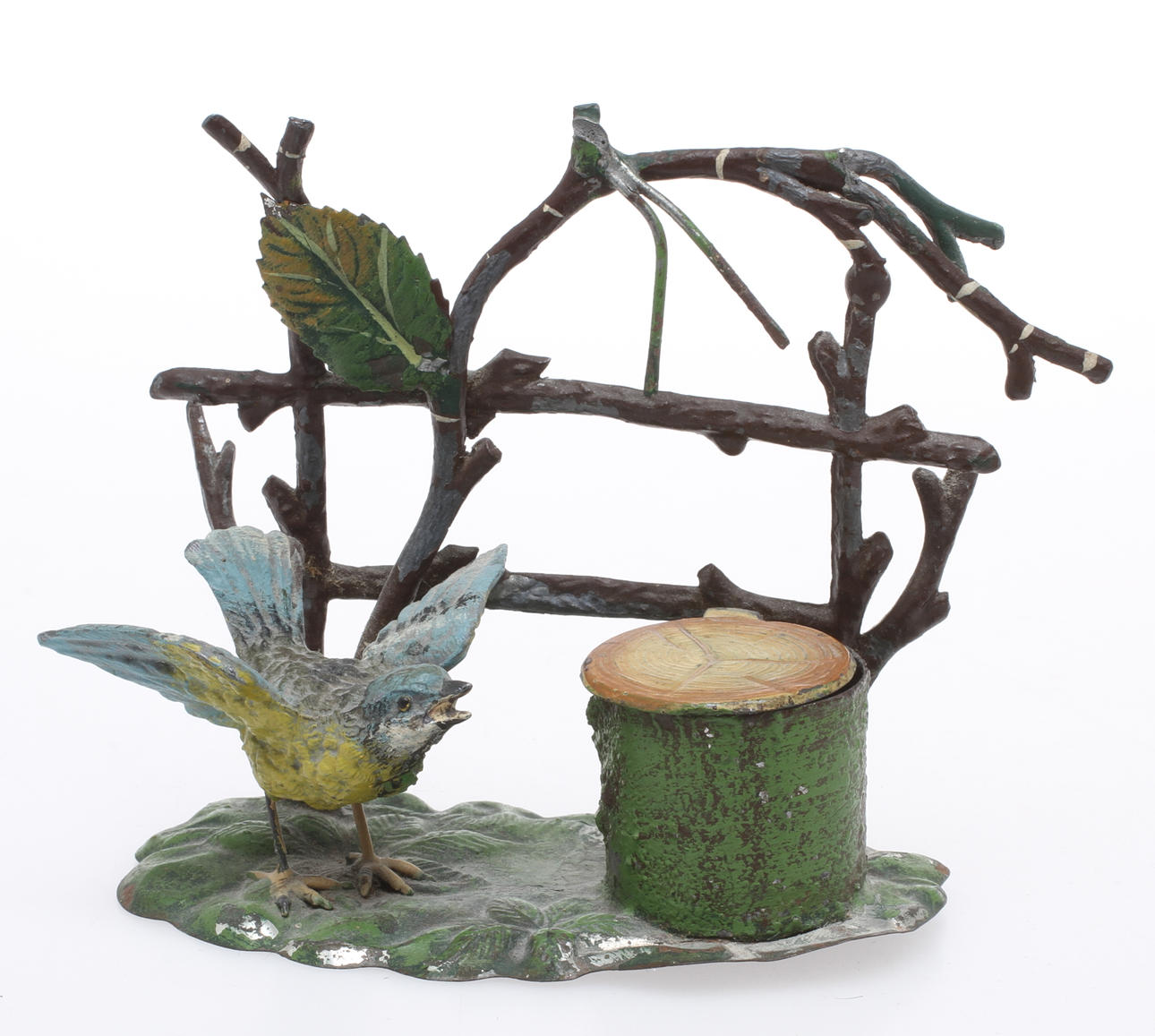 BLÄCKSTÄLL, bemålad metall, med fågel, 1900-talets första hälft.