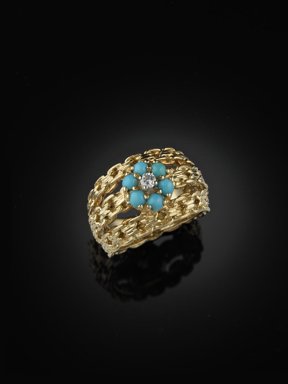 RING, 18 kt guld med 6 små cabochonslipade turkoser och en liten briljant.