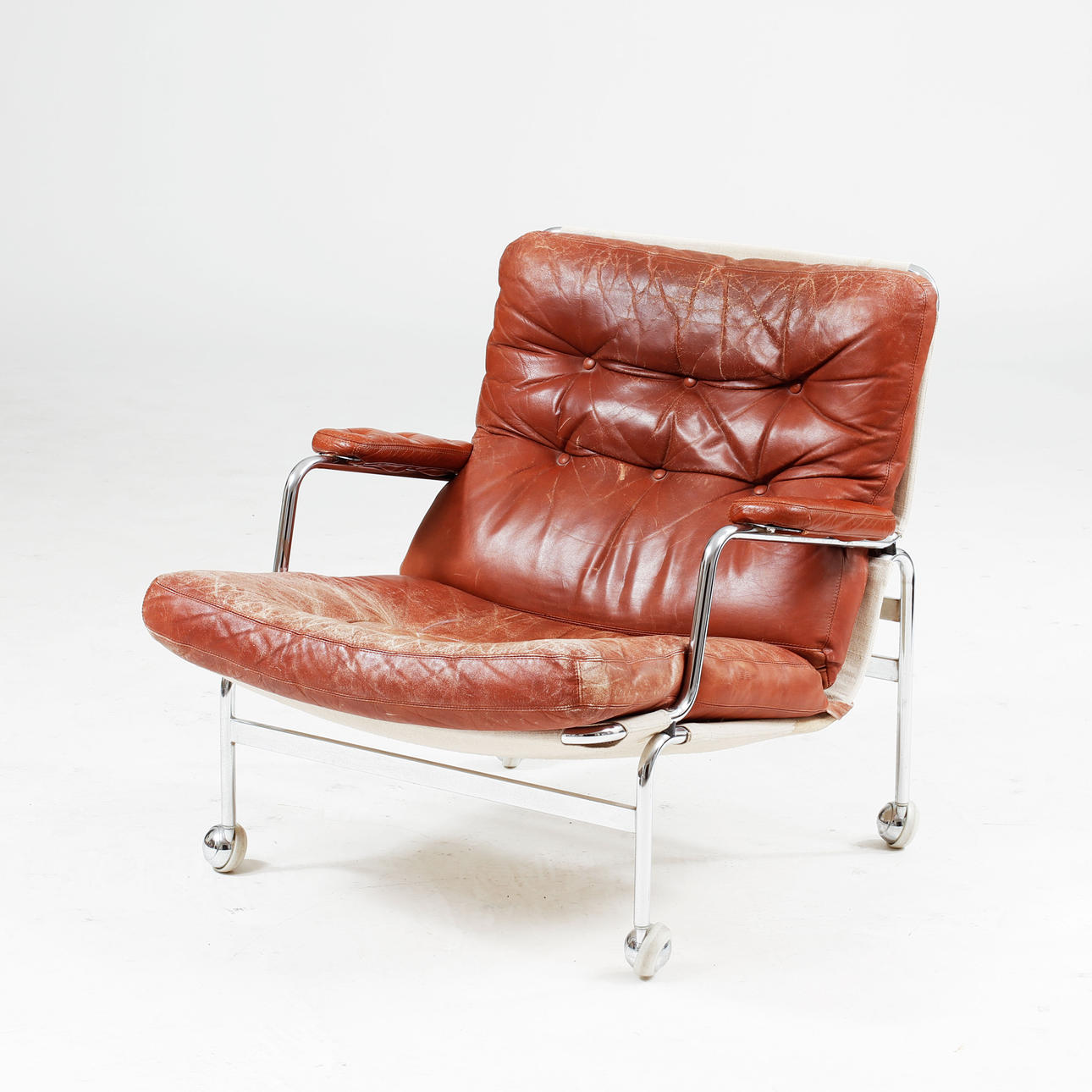 BRUNO MATHSSON. Armchair, "Karin", brown leather, Dux.