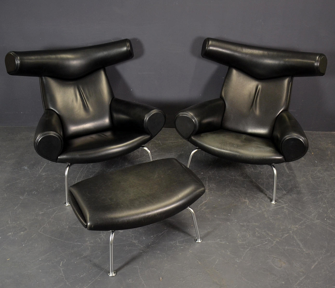 HANS J WEGNER. TWO OX CHAIRS WITH STOOL.
