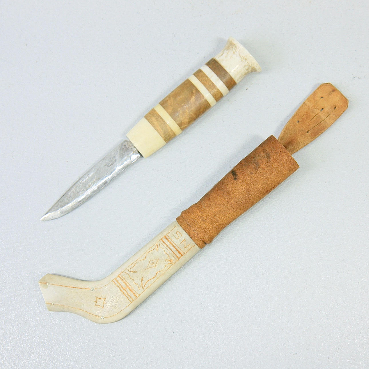 KNIFE, reindeer horn, marked NS.